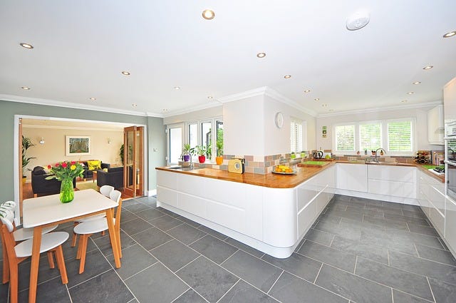 an interior of a kitchen and dining room