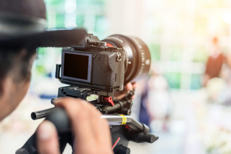 videographer using DSLR