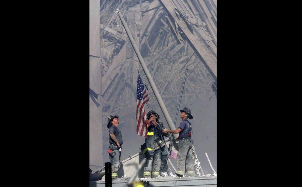 3-firemen-raise-flag-after-911
