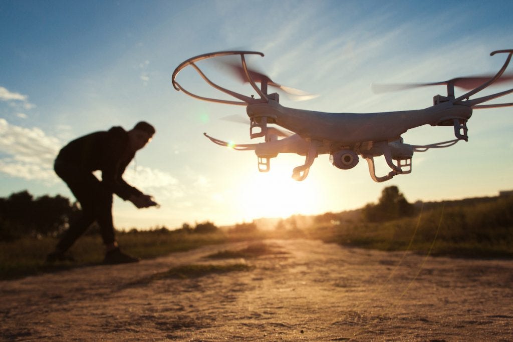 sunset-image-of-man-flying-drone