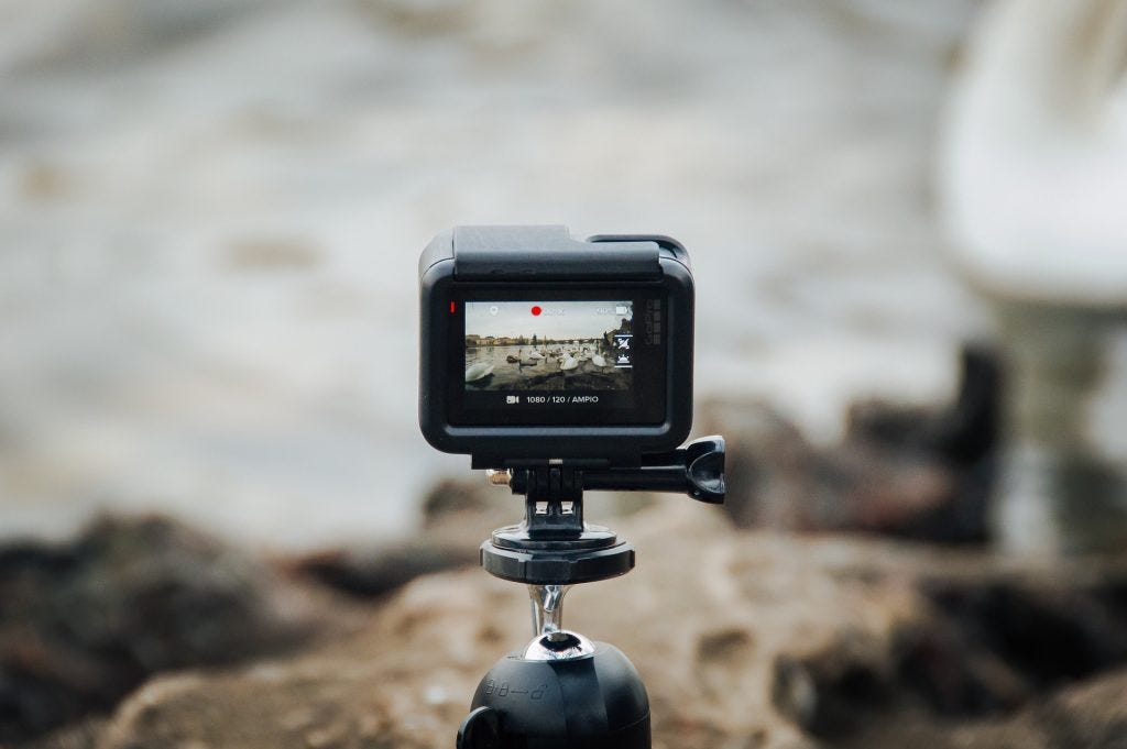 photographer-sets-up-gopro-on-tripod