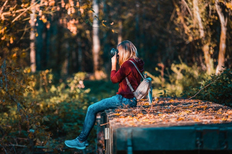 photographer with camera bag