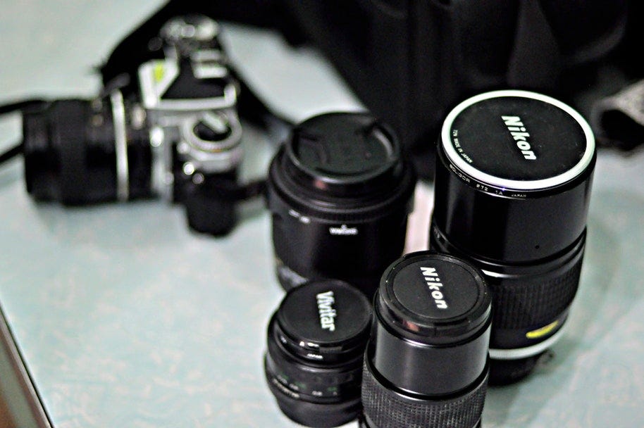 a selection of nikon prime lenses