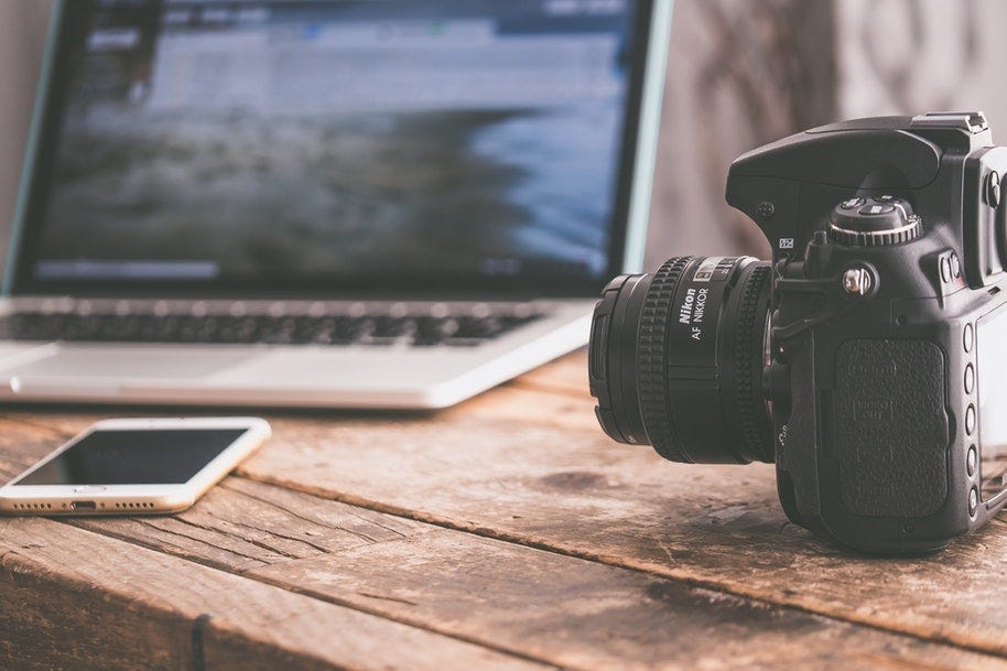 camera and phone with laptop
