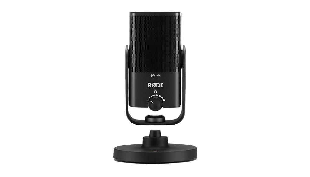 A Rode NT USB microphone on a desk tripod.