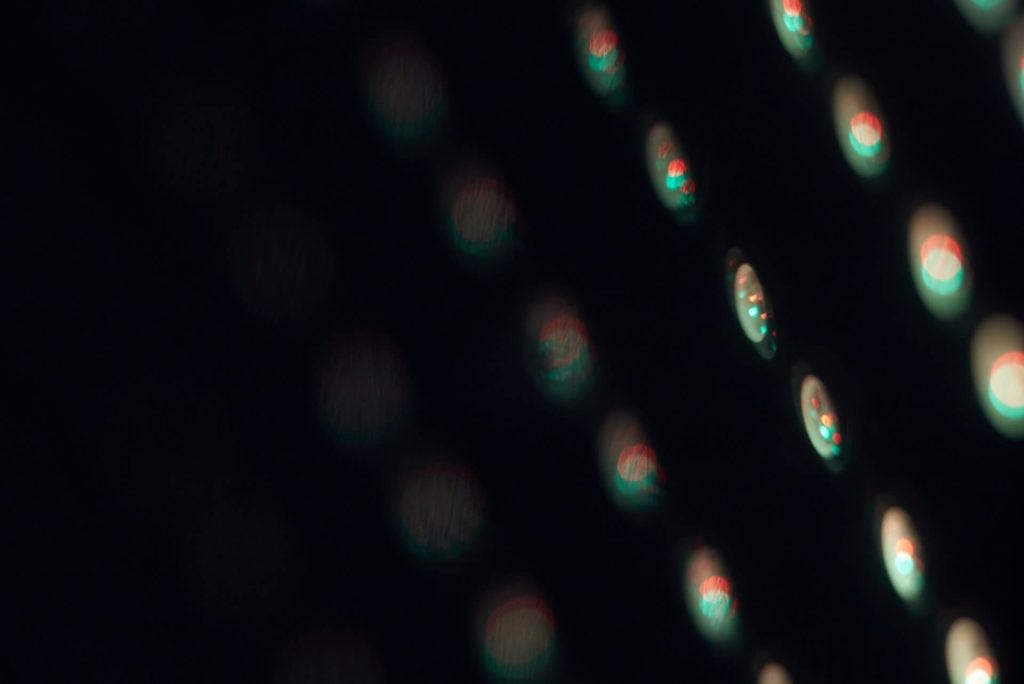 Rows of light issuring from pixels.